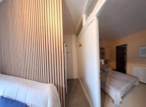 Posteľ alebo postele v izbe v ubytovaní Appartement 2 à 4 personnes Luchon centre