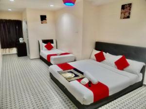 Katil atau katil-katil dalam bilik di Ar Rayyan Hotel