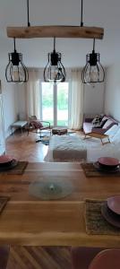 a bedroom with a large bed and a large window at Sienas Holiday Home in Vrnjačka Banja