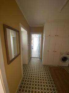 an empty room with a hallway leading to a laundry room at kremsoase in Krems an der Donau