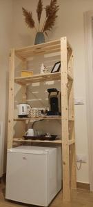a shelving unit in the corner of a kitchen at Il porto di Ale e Kat in Livorno
