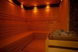 a sauna with a bench in a room with lights at Old Town Point Hotel & Spa Antalya in Antalya