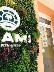 a plant on the side of a building at Miami Apartments in St. Julianʼs