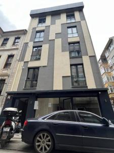 a car parked in front of a building at Remta Real Estate in Istanbul