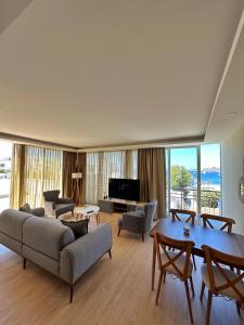 a living room with a couch and a table at BD Suites in Bodrum City