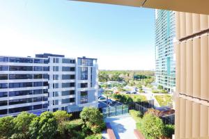 a view from the balcony of a building at Comfy & Bright 1 Bed Apt Olympic in Sydney