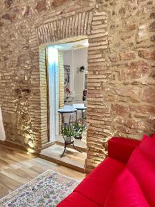 A seating area at B&B La Dimora di Tommaso Apartment - Dimora storica Bike Friendly