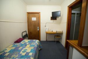 Llit o llits en una habitació de Brisbane Manor