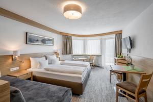 Postel nebo postele na pokoji v ubytování Apart Hotel Garni Wieser