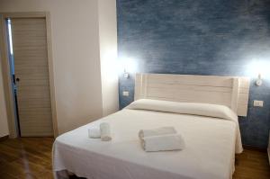 Posteľ alebo postele v izbe v ubytovaní Appartamenti La Baia del Raìs