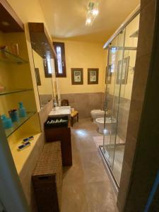a bathroom with a shower and a sink and a toilet at Lodge Villa Maria in Teolo