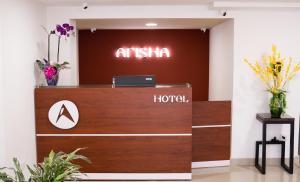 an entrance to an office with a reception desk at Hotel Arisha Cali in Cali