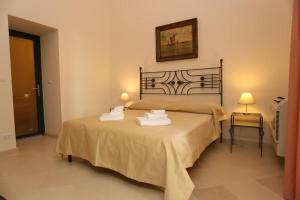 Postel nebo postele na pokoji v ubytování Villa Lucrezio Resort + 88 fotografií