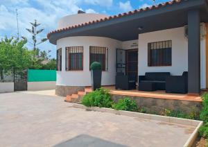 a house with a patio in front of it at CASA MARIA CINTA in Deltebre