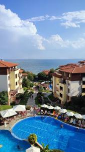 an aerial view of a resort with a swimming pool at Апартамент Ния, Райска градина / Garden of Eden in Sveti Vlas