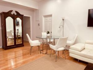 a living room with a table and chairs and a couch at Secluded*NEW3BED*3BATH*Beach*SPC-X*Airforcebase in Inglewood