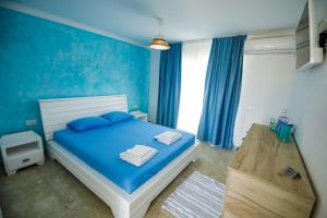 Postel nebo postele na pokoji v ubytování Casa Mavi