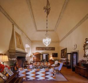 a large living room with a checkered floor at Villa Milesi in Franciacorta in Erbusco