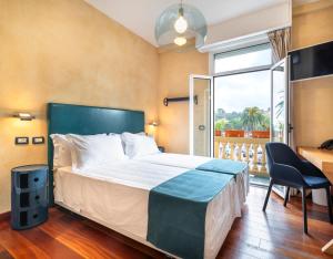 Postel nebo postele na pokoji v ubytování Rosabianca Boutique Hotel