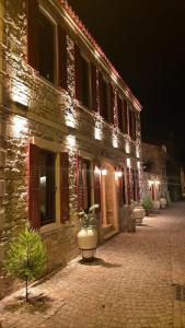 a building with a potted plant in front of it at Dionysos 1789 Boutique Hotel in Foca