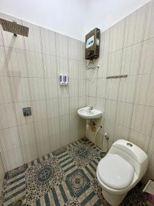 Koupelna v ubytování Mangir Homestay