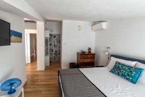 Postel nebo postele na pokoji v ubytování Bisu Isola di Sant'Antioco