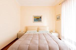 Delizioso attico a Talenti tesisinde bir odada yatak veya yataklar