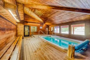 a pool in a room with a wooden ceiling at Premium Ski In Ski Out At Giants Steps Chairlift! in Brian Head