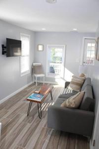 a living room with a couch and a coffee table at The Clark - Suite 2W - Ocean Grove near Asbury in Ocean Grove