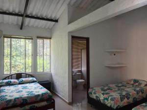 Postel nebo postele na pokoji v ubytování CASA CORAL