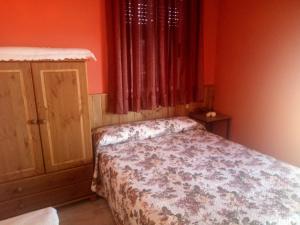 Posteľ alebo postele v izbe v ubytovaní Apartamentos La Presa