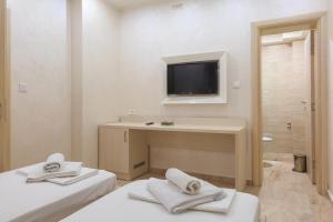 Postel nebo postele na pokoji v ubytování Hotel Maksim
