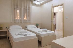 Postel nebo postele na pokoji v ubytování Hotel Maksim