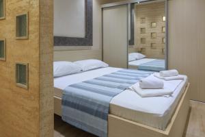 Postel nebo postele na pokoji v ubytování Hotel Maksim