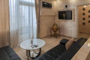 TV a/nebo společenská místnost v ubytování Hotel Maksim