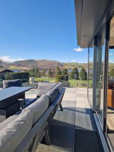 a row of benches on the patio of a house at Parklands in Penrith