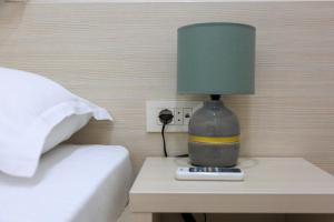 Postel nebo postele na pokoji v ubytování Hotel Maksim