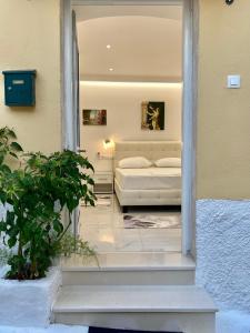 Postel nebo postele na pokoji v ubytování Corfu Port Art Studios