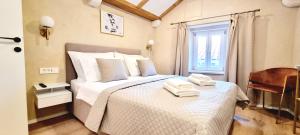 Ein Bett oder Betten in einem Zimmer der Unterkunft Mascheroni Luxury Rooms