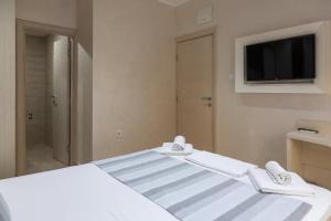 Postel nebo postele na pokoji v ubytování Hotel Maksim