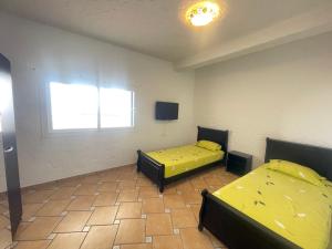 Postel nebo postele na pokoji v ubytování Chalet cabo negro