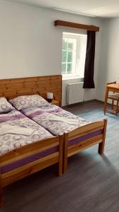 Postel nebo postele na pokoji v ubytování Horské Apartmány Smrčina