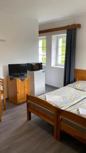 Postel nebo postele na pokoji v ubytování Horské Apartmány Smrčina