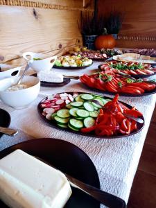 a table with three plates of vegetables on it at Sokolisko - pensjonat agroturystyczny in Wysoczany