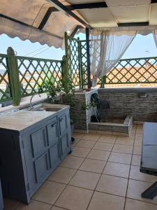 an outdoor kitchen with a sink and a tub at Green House in Nea Peramos +102 photos