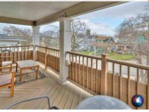 a large deck with a view of a house at Two bedrooms unit with jacuzzi and great view in Niagara Falls