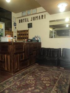 a bar with a couch and a counter in a store at Hotel Jumari in Uyuni