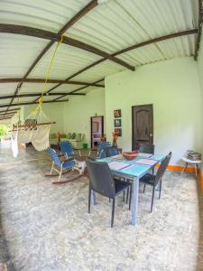 a dining room with a table and chairs at Finca San Cayetano - Minca in Arimaca