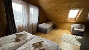 Postel nebo postele na pokoji v ubytování CHALET COBURG