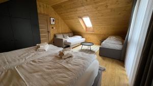 Postel nebo postele na pokoji v ubytování CHALET COBURG